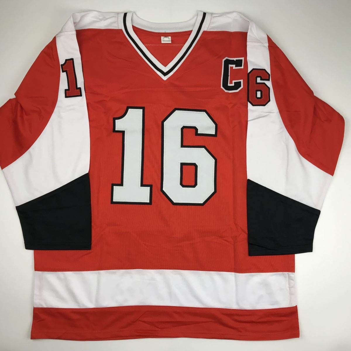Red, white, and black hockey jersey with number 16 displayed flat against neutral background, front view.