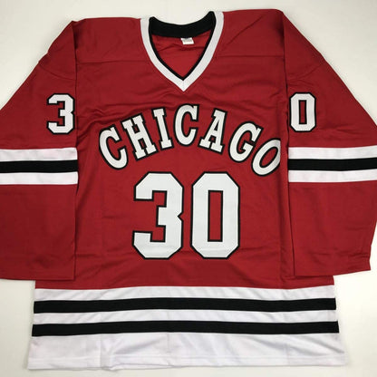 Red Chicago hockey jersey with white "CHICAGO" text and number 30, displayed flat against neutral background.