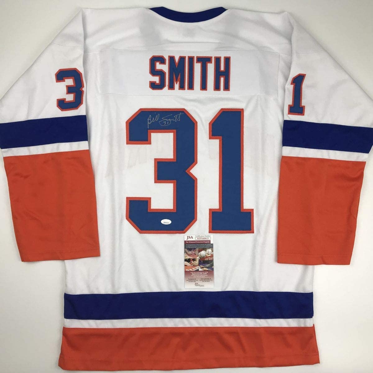 Back view of white hockey jersey with red and blue stripes, number 31, "SMITH" nameplate, and JSA authentication certificate.