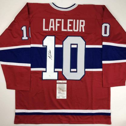 Back view of red, white, and blue Montreal Canadiens hockey jersey numbered 10 with LaFleur nameplate and JSA authentication certificate.