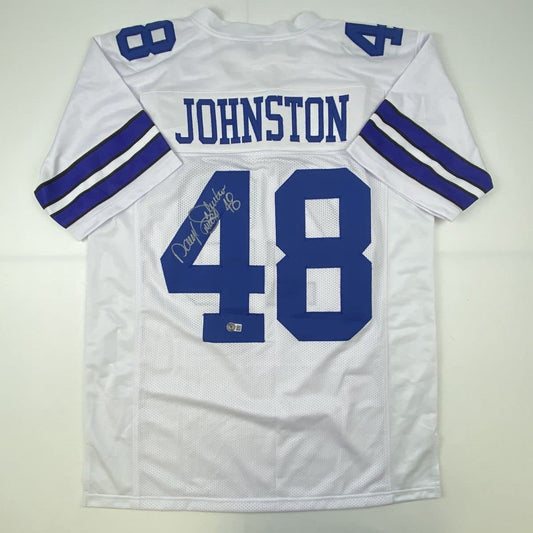 White Dallas Cowboys jersey number 48 with "JOHNSTON" nameplate, displayed flat with autographed signature visible on the number.