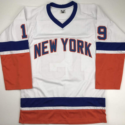 White New York Rangers hockey jersey with navy and red horizontal stripes, displaying numbers 1 and 9 on sleeves, flat lay view.