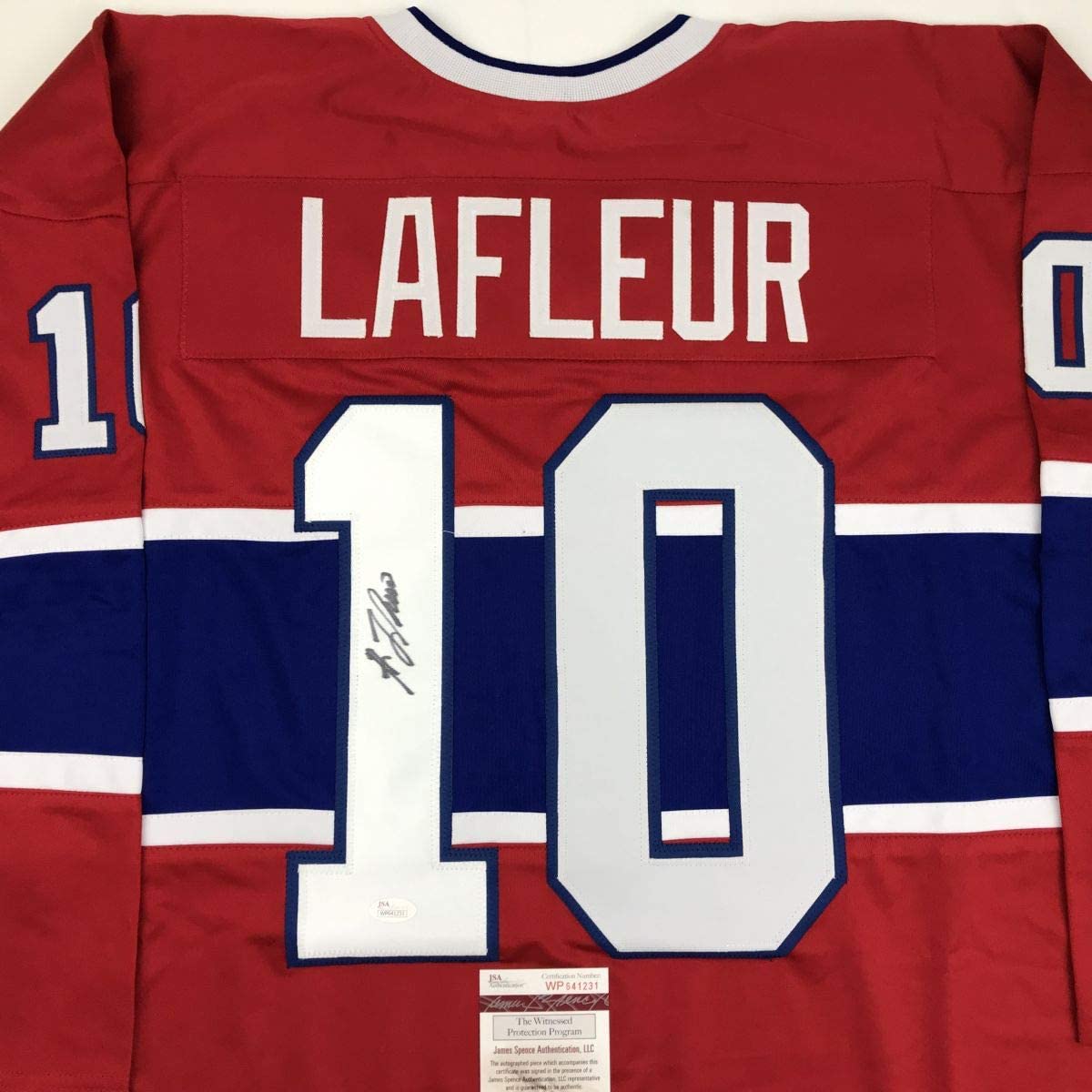 Red and blue Montreal Canadiens jersey displaying "LAFLEUR" and number "10" with visible autograph and JSA authentication label.