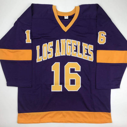 Purple and gold Los Angeles hockey jersey with number 16 displayed flat on white background, showing front view with orange stripe trim.