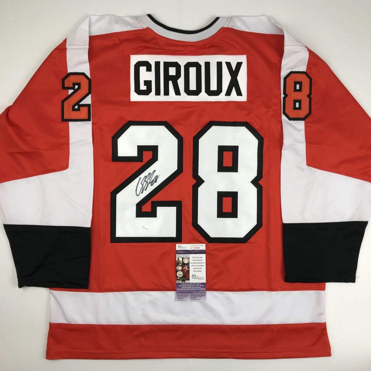 Back view of red, white, and black hockey jersey numbered 28 with "GIROUX" nameplate and autograph, displaying JSA authentication certificate.