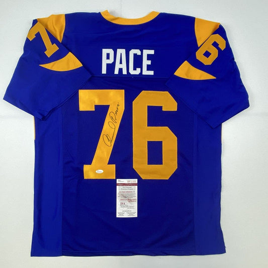 Blue and gold St. Louis Rams football jersey with "PACE" and number "16" displayed flat against white background, showing JSA authentication certificate.