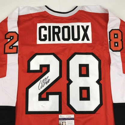 Red and white striped Philadelphia hockey jersey with "GIROUX" and number 28, signed in black marker, displayed flat with JSA authentication label visible.