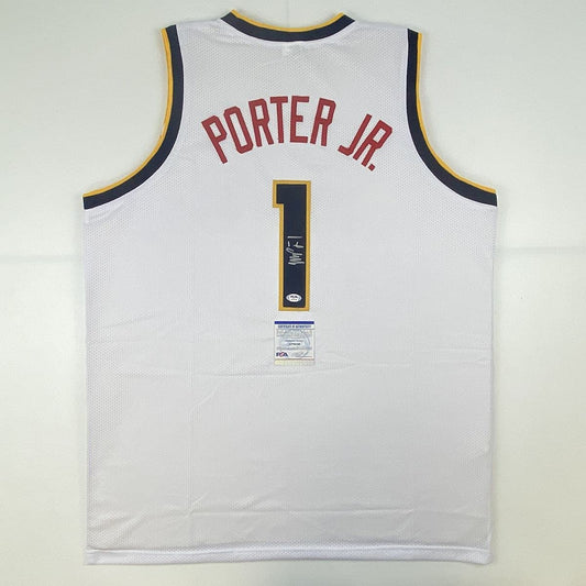 Back view of white Denver Nuggets jersey number 1 with "PORTER JR." in red lettering and PSA authentication certificate visible on chest.