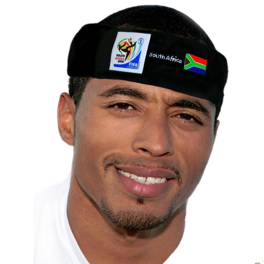 Man wearing black fabric headband with 2010 FIFA World Cup South Africa logo and South African flag, front-facing portrait view.