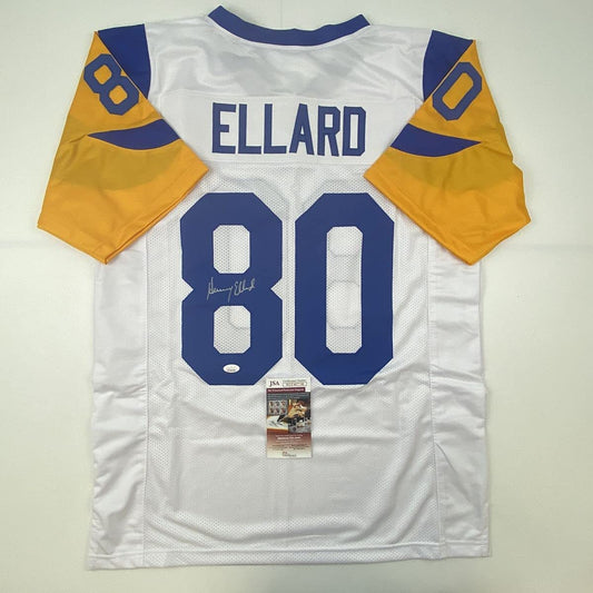 Back view of white Los Angeles Rams football jersey number 80 with "ELLARD" nameplate, blue and gold shoulders, displaying JSA authentication certificate.