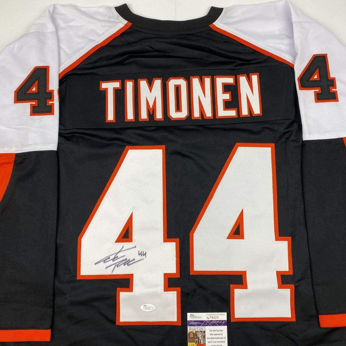 Back view of black Philadelphia Flyers jersey number 44 with "TIMONEN" nameplate and signature, showing JSA authentication label.