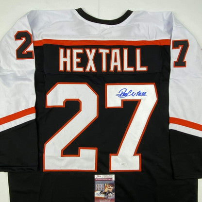 Back view of signed black Philadelphia Flyers hockey jersey number 27 with "HEXTALL" nameplate and JSA authentication certificate.
