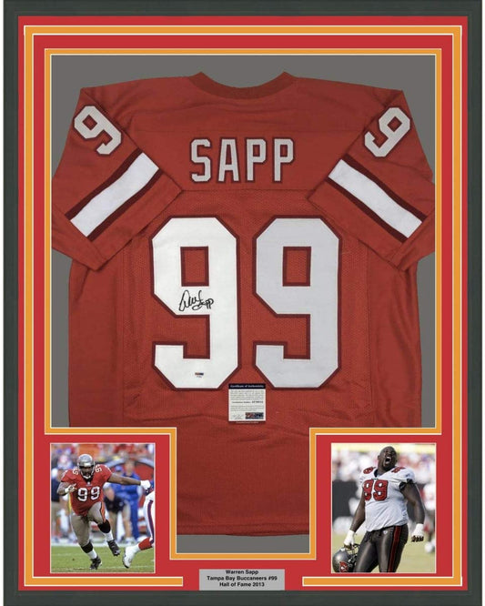 Framed back view of a red jersey with white SAPP lettering, number 99, black signature, and PSA/DNA certificate tag.