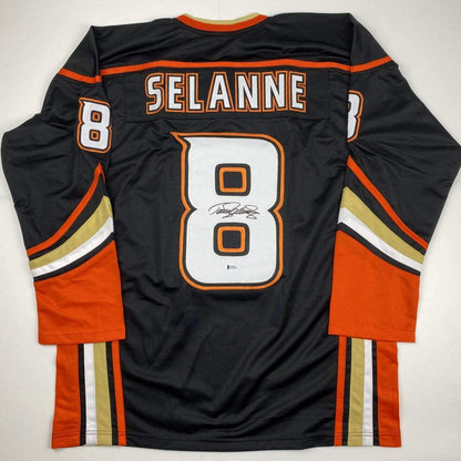 Autographed/Signed Teemu Selanne Anaheim Black Hockey Jersey Beckett BAS COA