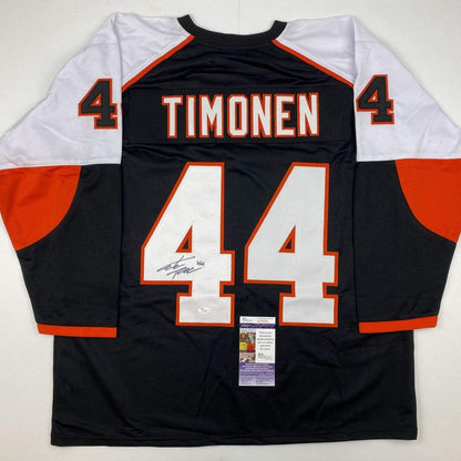 Back view of black, white, and orange hockey jersey displaying "TIMONEN" and number 44 with autograph and JSA authentication sticker.