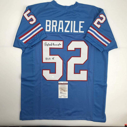 Autographed/Signed Robert Brazile Hall of Fame Houston Blue Football Jersey JSA COA