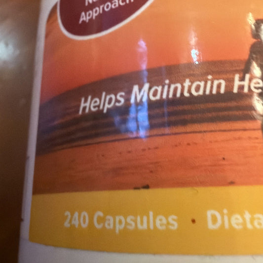 Close-up of supplement bottle label showing "Helps Maintain He" text on orange and brown packaging with yellow stripe indicating 240 Capsules.