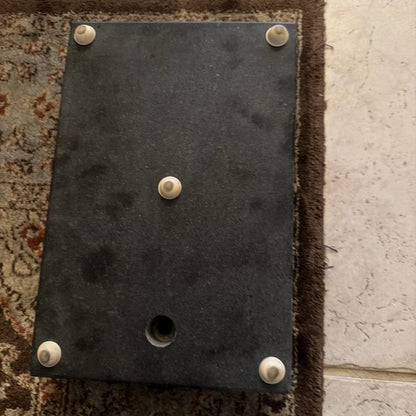 Back of 8 x 12 x 2 inch granite surface plate with black metal plate and screws