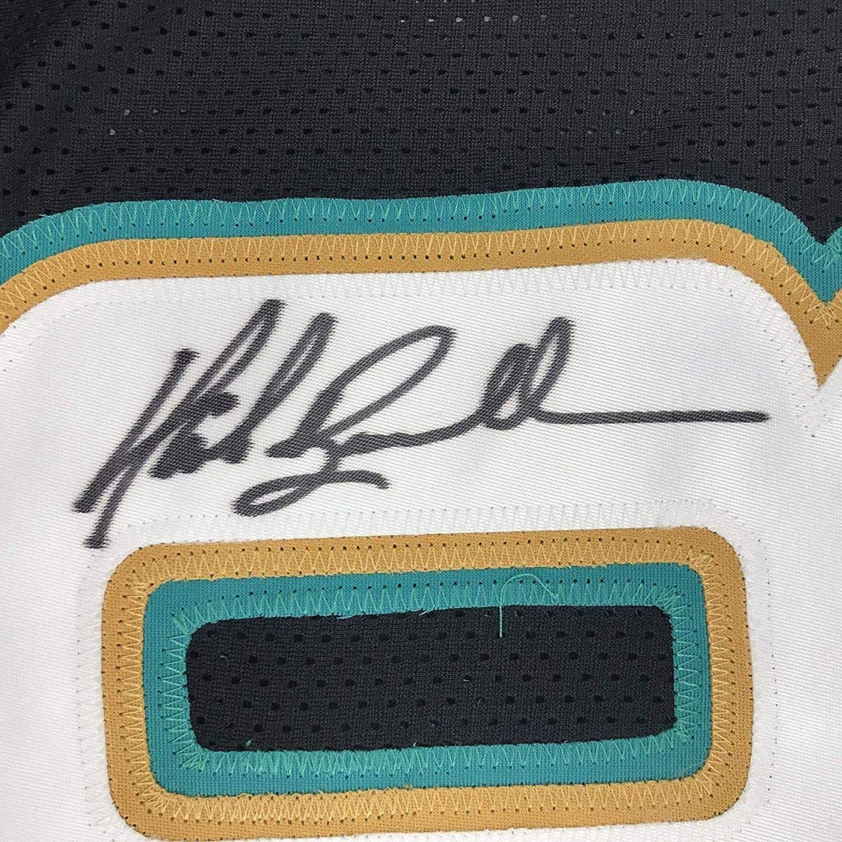 Close-up of Mark Brunell autograph on custom black football jersey JSA authenticated