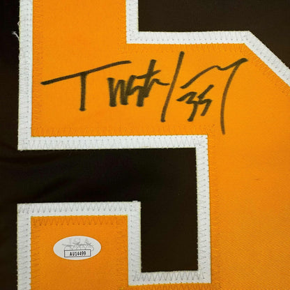 Close-up of handwritten signature on orange and black hockey jersey with white trim and JSA authentication sticker.