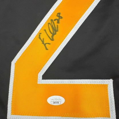 Close-up of yellow hockey jersey stripe with handwritten signature and JSA authentication sticker displaying certificate number C867578.