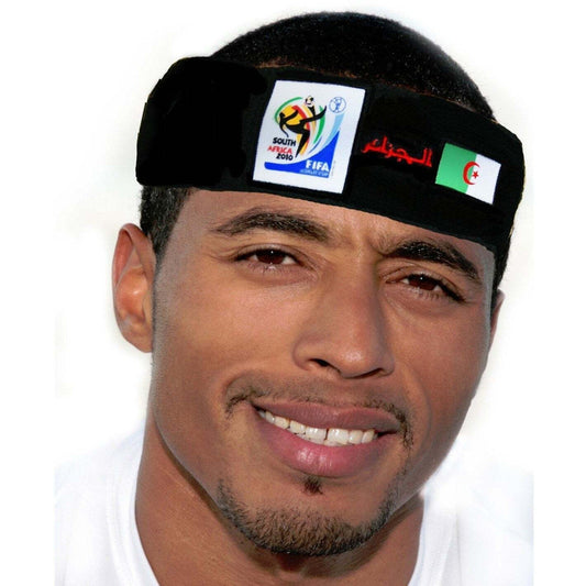 Man wearing black fabric headband with FIFA 2010 South Africa logo and Algerian flag, smiling at camera.