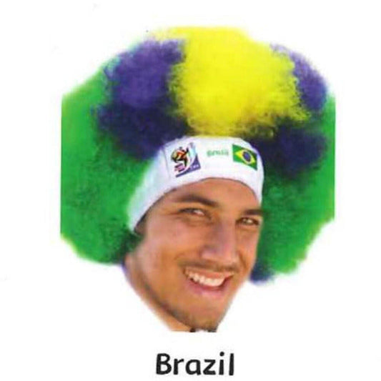 Man wearing green, yellow, and blue afro wig with white headband displaying Brazilian flag and World Cup logo.