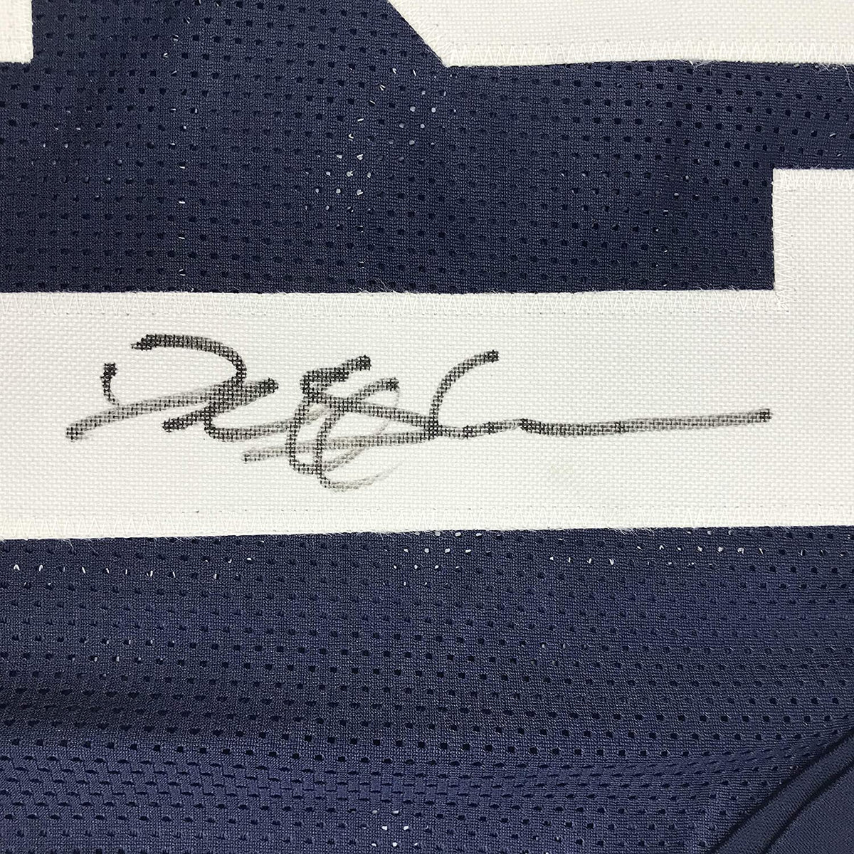 Close-up of Deion Sanders autograph on custom Dallas Thanksgiving Day football jersey JSA authenticated