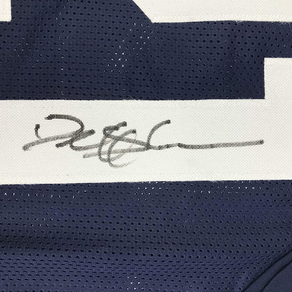 Close-up of Deion Sanders autograph on custom Dallas Thanksgiving Day football jersey JSA authenticated