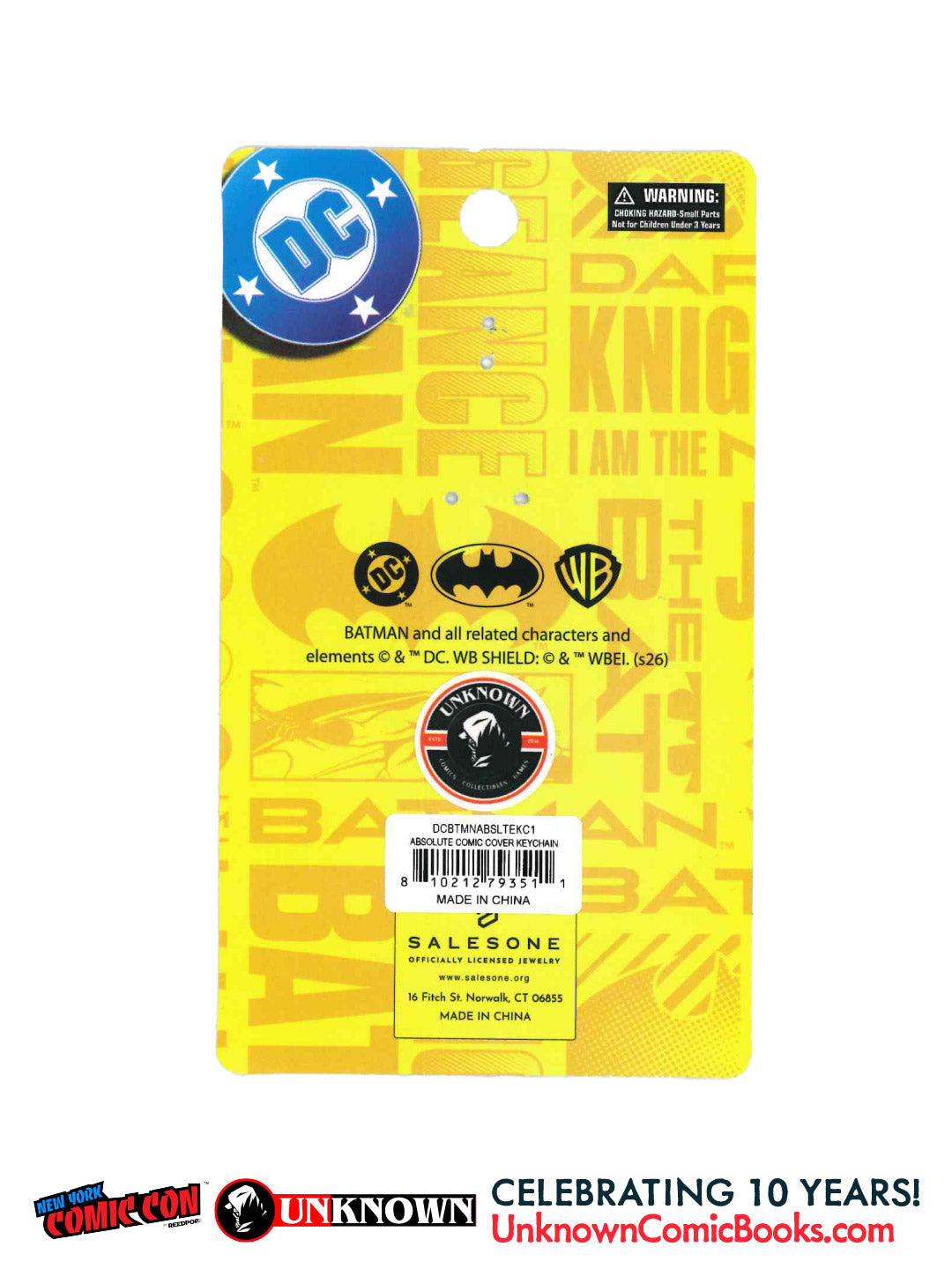 Back of a yellow Batman packaging card showing the DC logo, a warning label, a barcode reading DCBTMNABSLTEKC1, and Salesone licensing details.