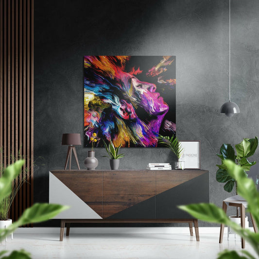 Colorful neon paint splash artwork featuring a singing profile with vibrant magenta, purple, blue, and gold brushstrokes displayed above a wooden console table in a modern interior.