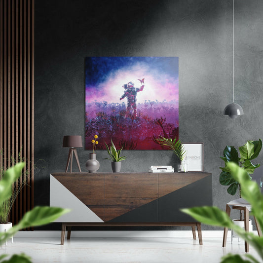 Modern interior with astronaut artwork mounted on textured gray wall above wooden dresser with plants and decor.