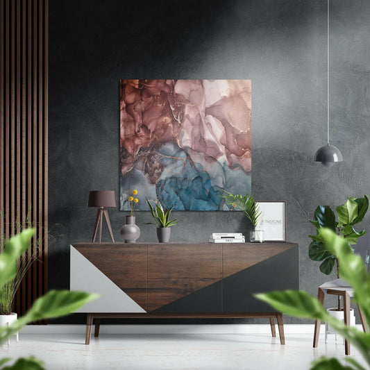 Modern living room displaying rust, red, and teal abstract marble artwork on textured gray wall above wooden dresser.