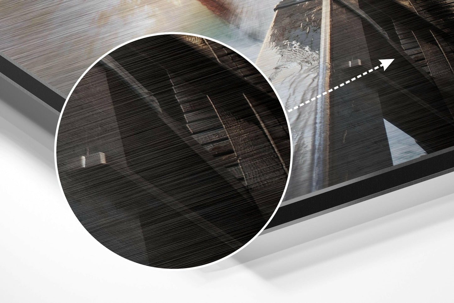 Close-up magnified view of brushed aluminium surface texture with diagonal line details and architectural structure visible in background.