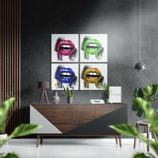 Four-panel pop art aluminum wall display featuring colorful glossy lips in pink, green, blue, and gold mounted above a wooden dresser in modern interior setting.