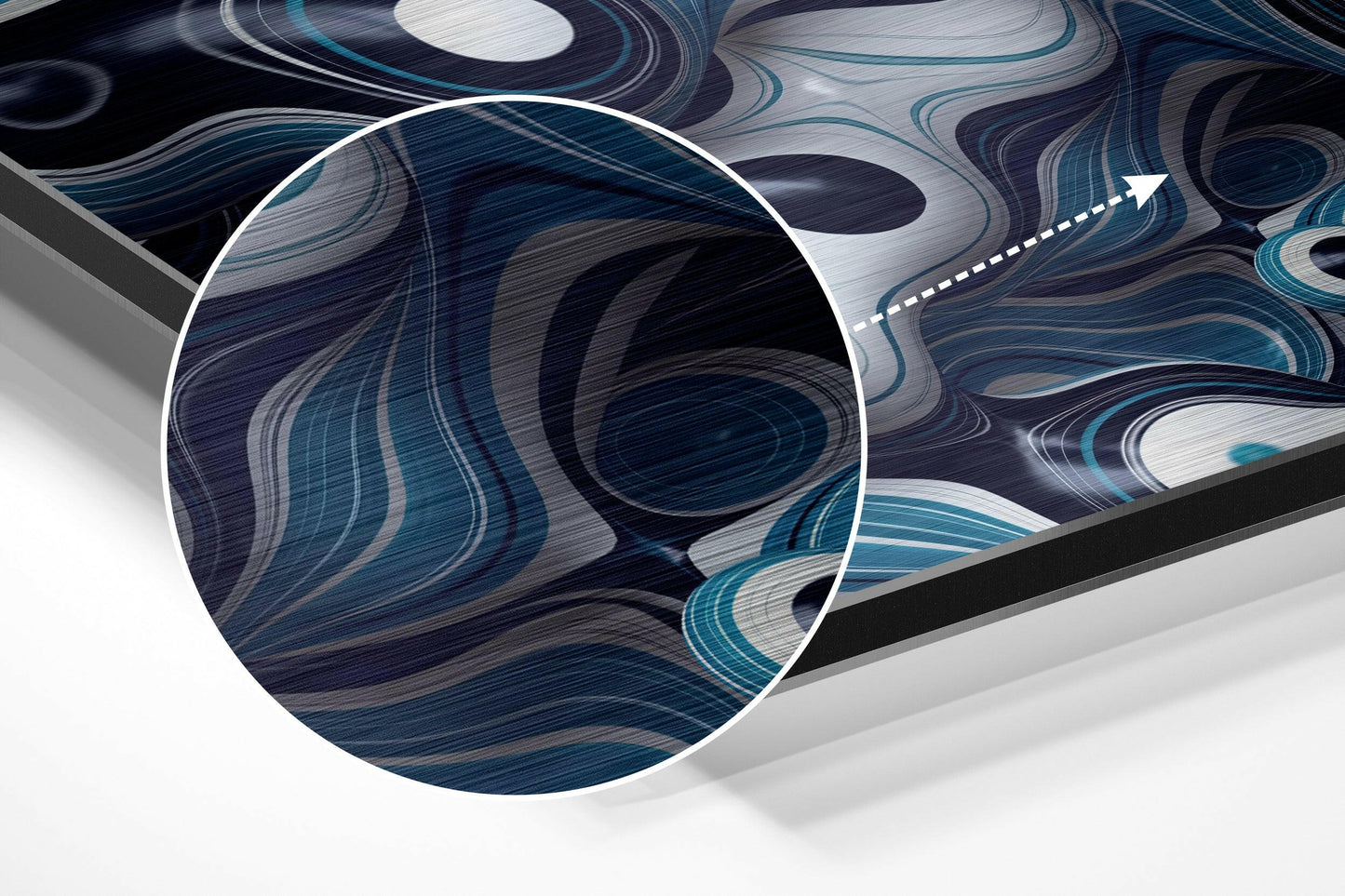 Close-up detail of brushed aluminium wall art showing swirling blue, teal, and white abstract patterns with circular magnified section and directional arrow.