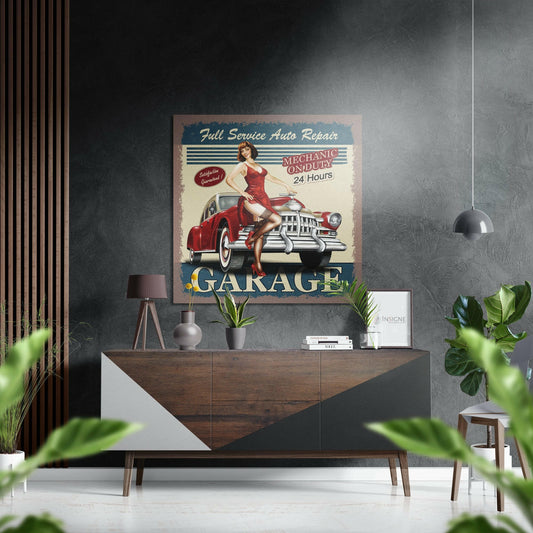 Vintage "Full Service Auto Repair Garage" metal sign displayed above a wooden dresser in a modern interior with plants and pendant lighting.