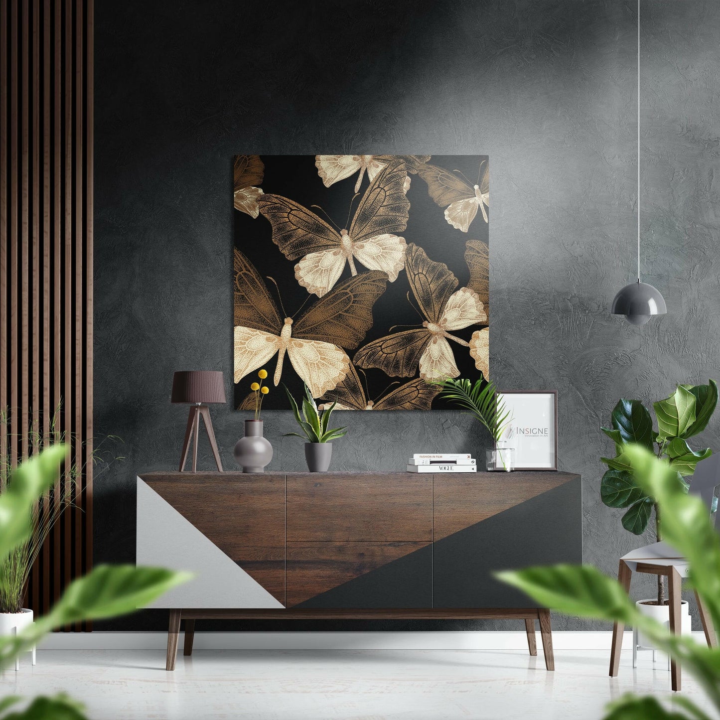 Gold and cream butterflies on black background displayed above wooden dresser in modern interior setting.