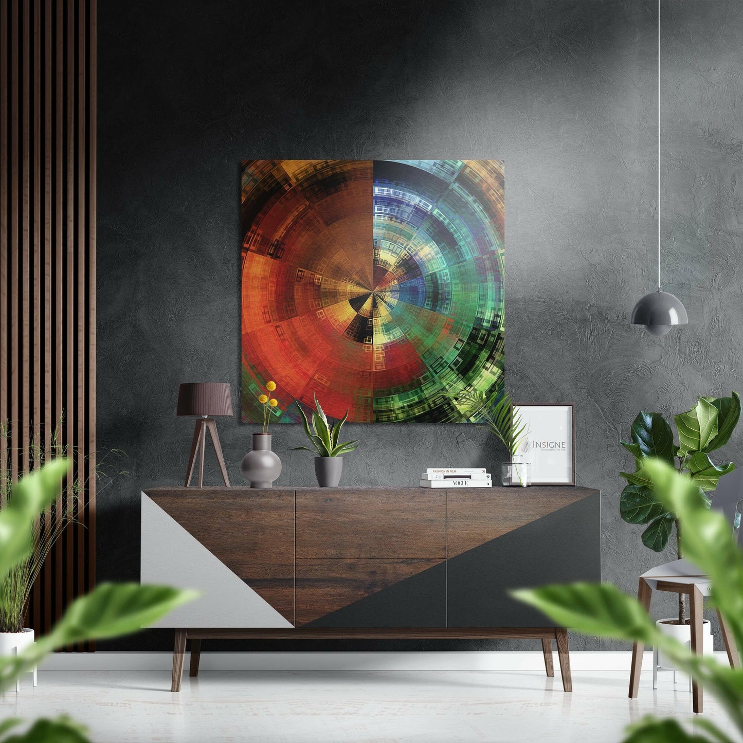 Colorful radial digital art with red, orange, yellow, green, and blue concentric circles displayed on aluminum above a wooden dresser in a modern interior.