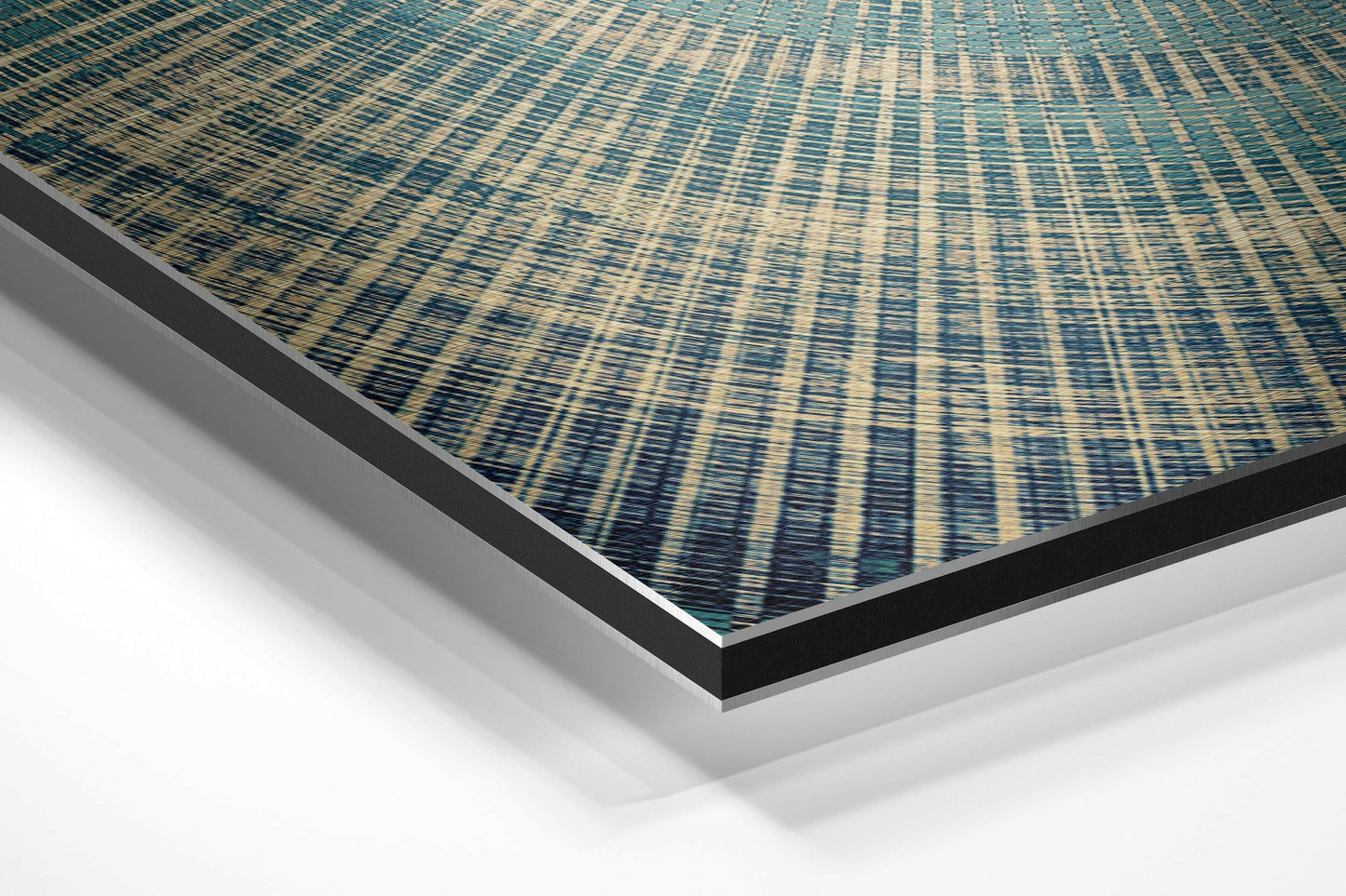 Angled perspective view of teal and cream striped textile pattern on brushed aluminum dibond panel with black and silver edges.