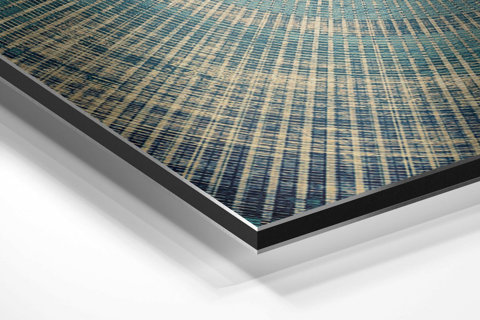 Angled perspective view of teal and cream striped textile pattern on brushed aluminum dibond panel with black and silver edges.
