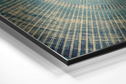 Angled perspective view of teal and cream striped textile pattern on brushed aluminum dibond panel with black and silver edges.