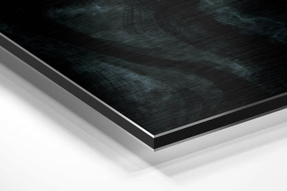 Close-up angled view of layered Dibond wall art with brushed black aluminum top surface and white backing layers.