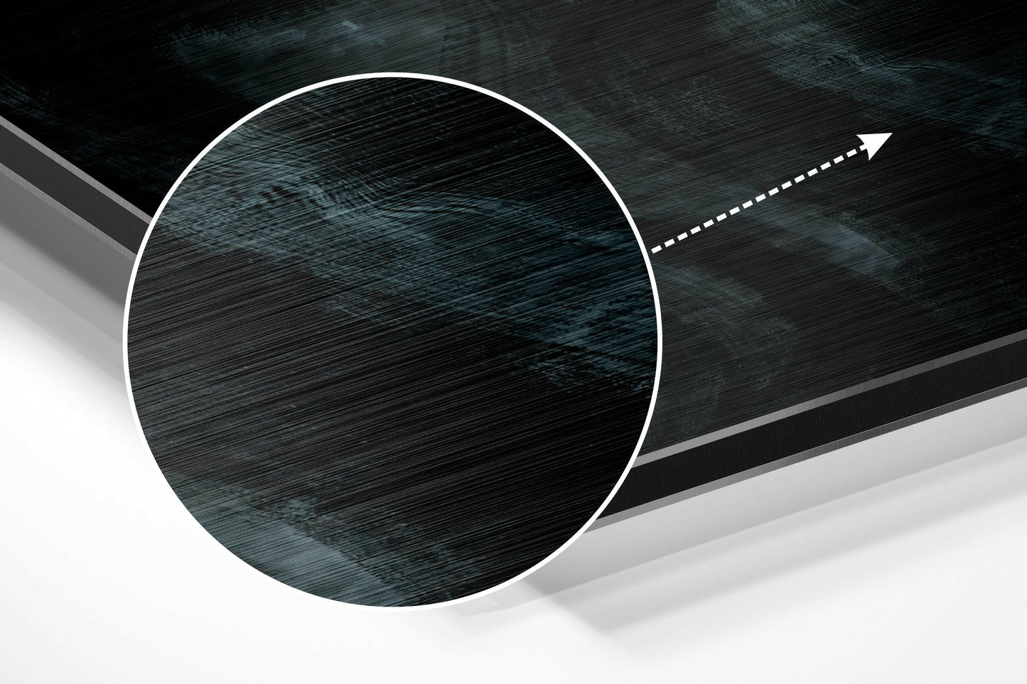 Close-up angled view of brushed aluminium dibond showing dark wood grain texture with white circular border and directional arrow.