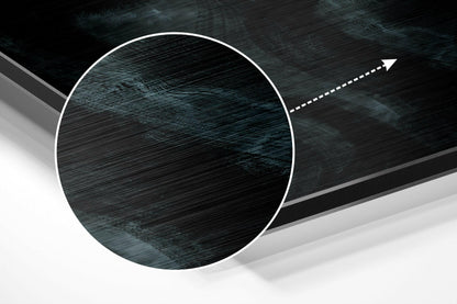 Close-up angled view of brushed aluminium dibond showing dark wood grain texture with white circular border and directional arrow.