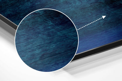 Abstract 3D product display of circular brushed aluminium panel with blue horizontal texture and directional arrow graphic.