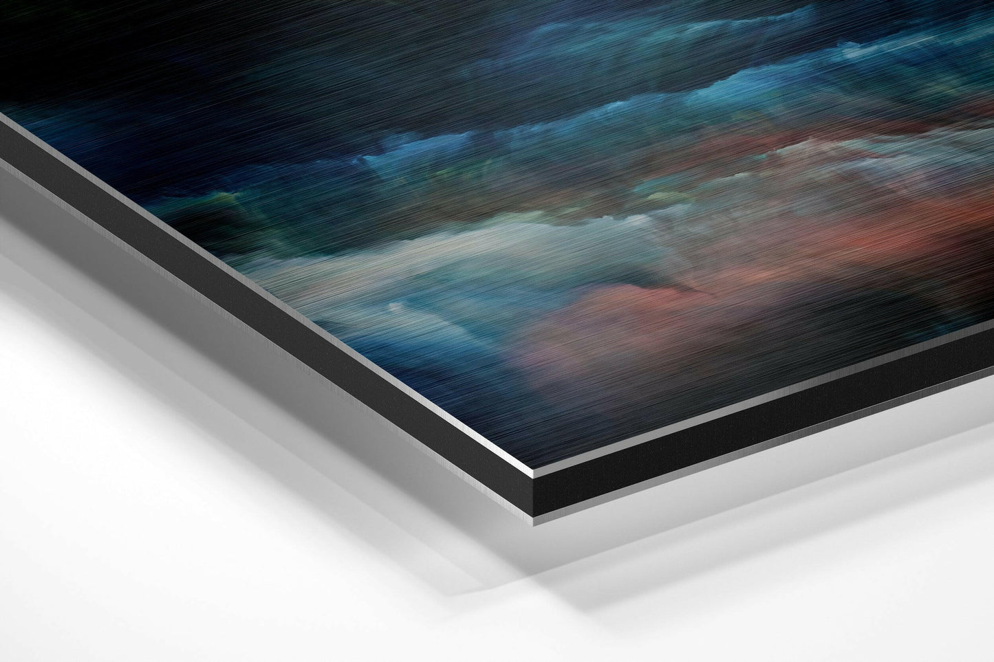 Angled perspective view of brushed aluminum Dibond wall art with blue, teal, and rust-colored abstract brushstroke design.