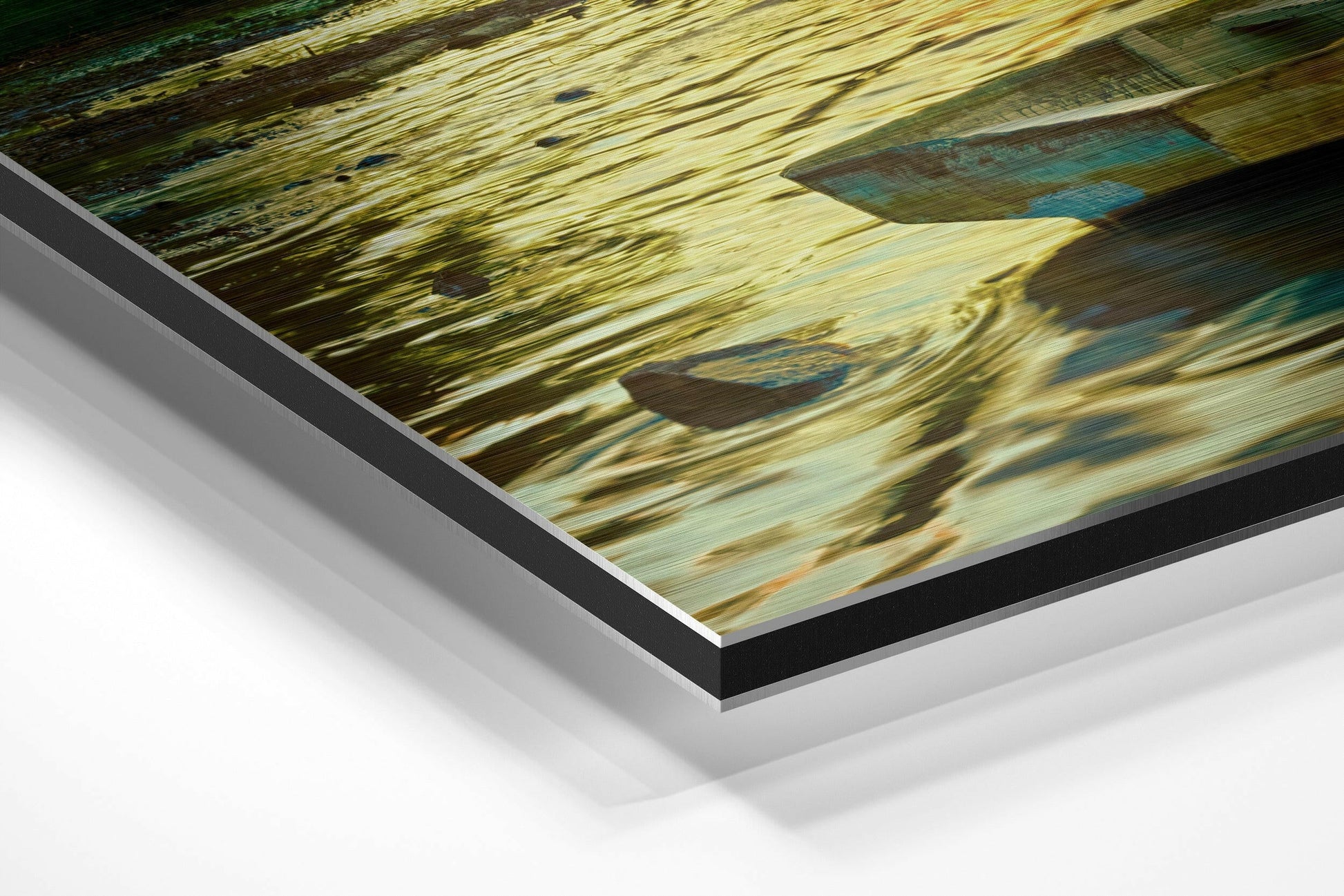 Angled close-up view of layered brushed aluminum and black-edged Dibond panel displaying weathered wooden boat detail with blue and golden tones.
