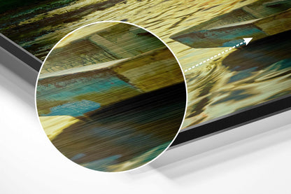 Close-up cross-section view of rolled brushed aluminum dibond panel showing layered striped pattern in gold, turquoise, and dark tones.