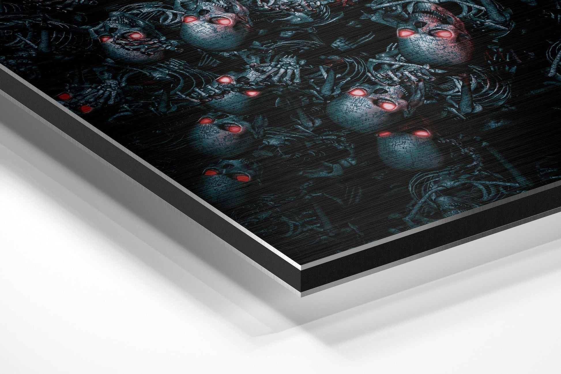 Angled perspective view of brushed aluminium Dibond wall art displaying dark teal androids with glowing red eyes on black background.